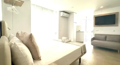 Una televisión o centro de entretenimiento en Apartamento Andrés Tamayo AV AMERICA