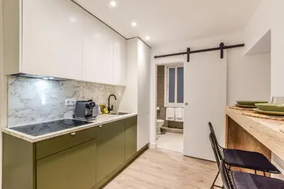 Una cocina o zona de cocina en Acogedor apartamento Gran Via -No Ascensor-