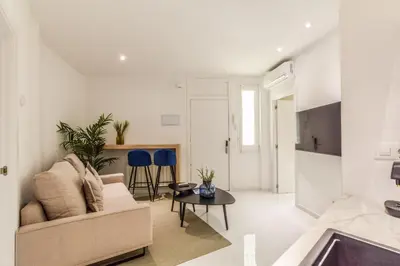 Una televisión o centro de entretenimiento en Apartamento Embajadores X