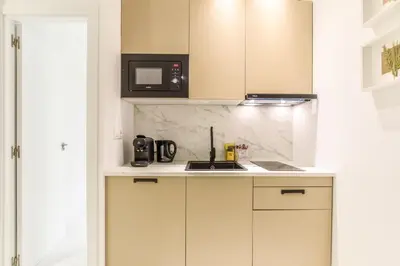 Una cocina o zona de cocina en Apartamento Embajadores X