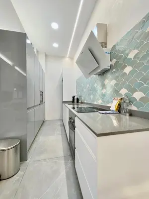 Una cocina o zona de cocina en Madrid Vistillas - Apartamento Acogedor