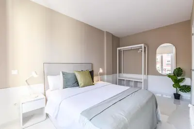 Cama o camas de una habitación en Apartamento Embajadores XII