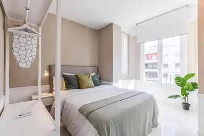 Cama o camas de una habitación en Apartamento Embajadores XII