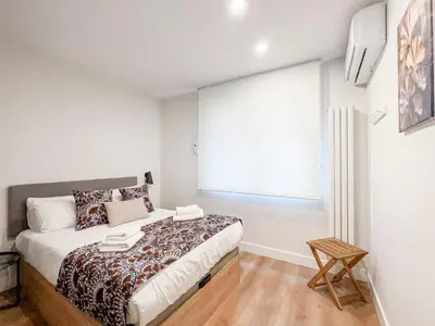 Cama o camas de una habitación en Piso elegante Atocha 2H/2B by Berlany España