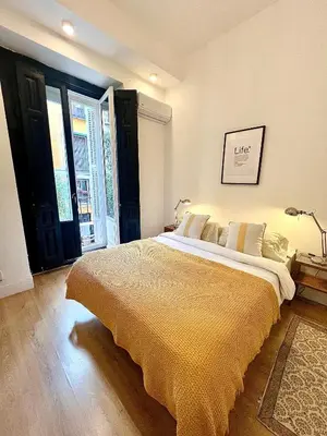 Cama o camas de una habitación en Urban rooms Fuencarral