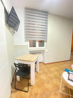 Una televisión o centro de entretenimiento en Encantador Piso Zamora Temporal