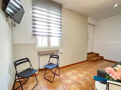 Una televisión o centro de entretenimiento en Encantador Piso Zamora Temporal