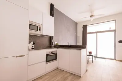 Una cocina o zona de cocina en Dúplex en Antón Martín 4 Personas