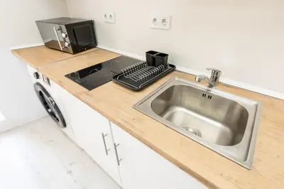 Una cocina o zona de cocina en Los Apartamentos Jacinto Benavente Centro Madrid