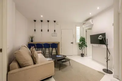 Una televisión o centro de entretenimiento en Apartamento Embajadores XV