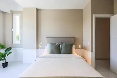 Cama o camas de una habitación en AmazINN Collection Madrid Embajadores