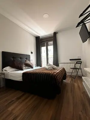 Cama o camas de una habitación en Hostal Arenal Madrid