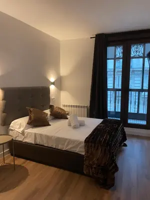 Cama o camas de una habitación en Hostal Arenal Madrid