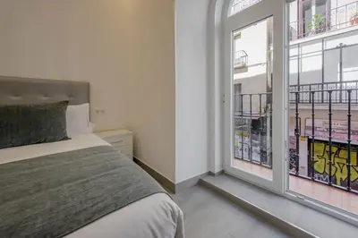 Cama o camas de una habitación en SUARA Apartamentos 2