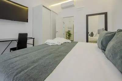 Cama o camas de una habitación en SUARA Apartamentos 2