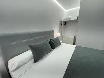 Cama o camas de una habitación en SUARA Apartamentos 3