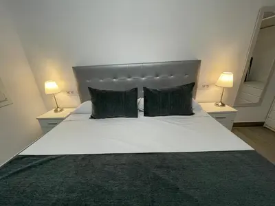 Cama o camas de una habitación en SUARA Apartamentos 3